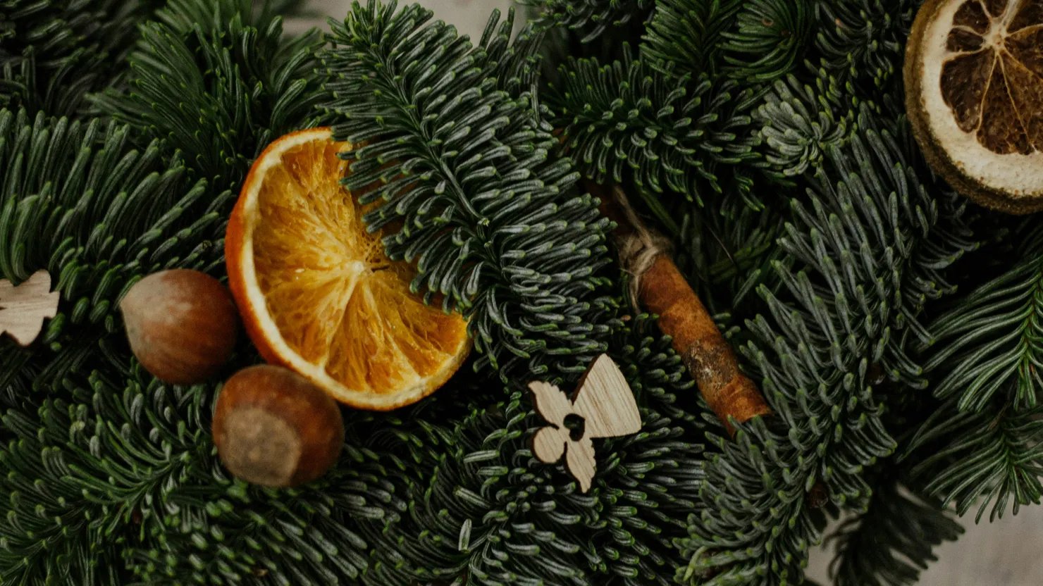 Natural materials for wreath making including orange slices and fir tree