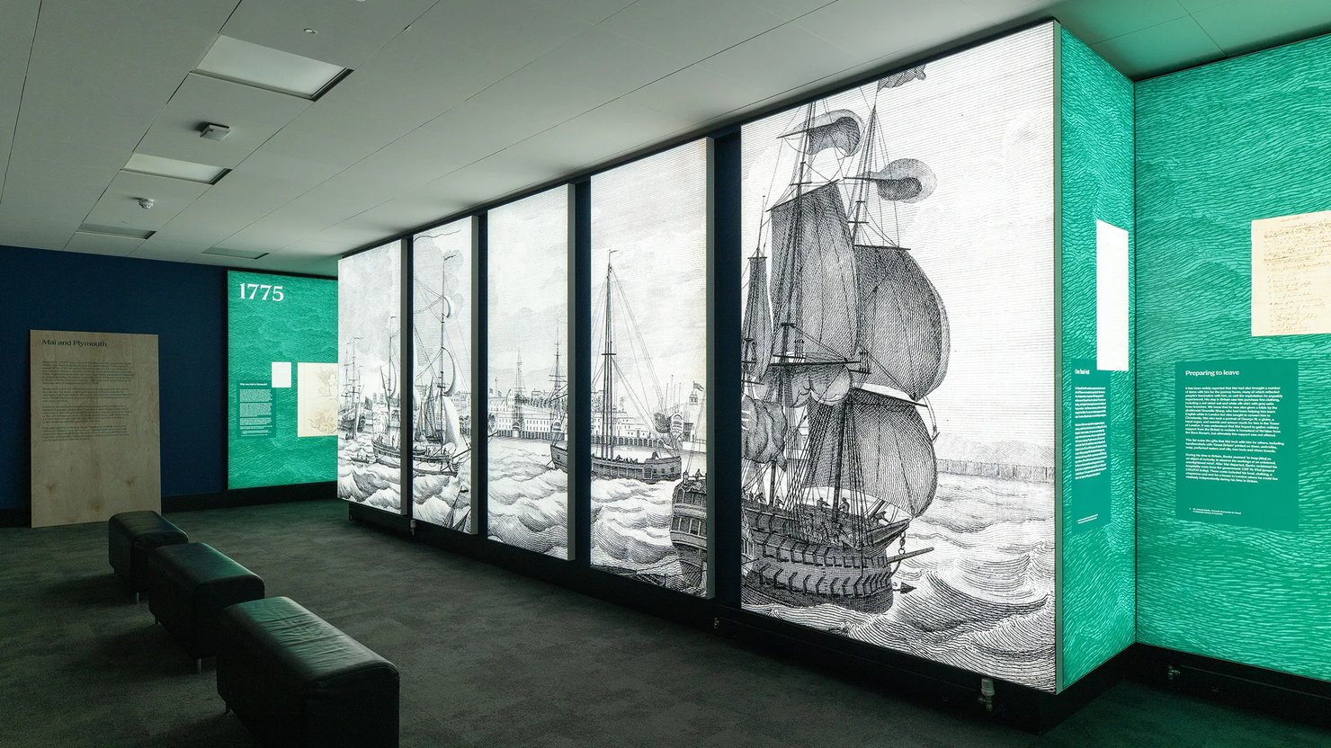 Photograph showing a large engraving on display in lightboxes in Bridge Gallery
