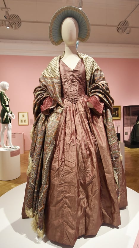 Silk dress and shawl on display in the 'Dress Code' exhibition