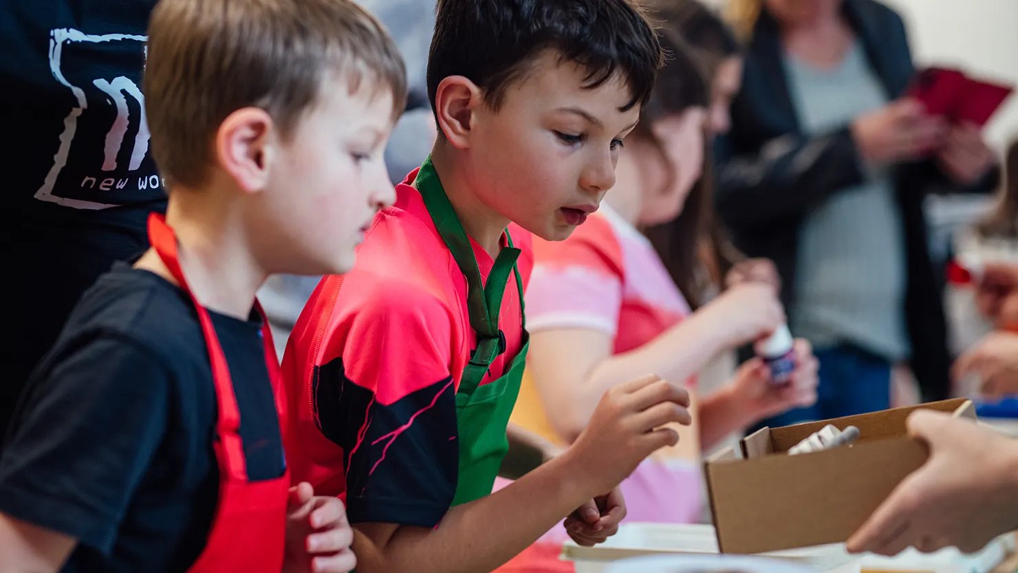 Photograph showing two boys in a painting workshop