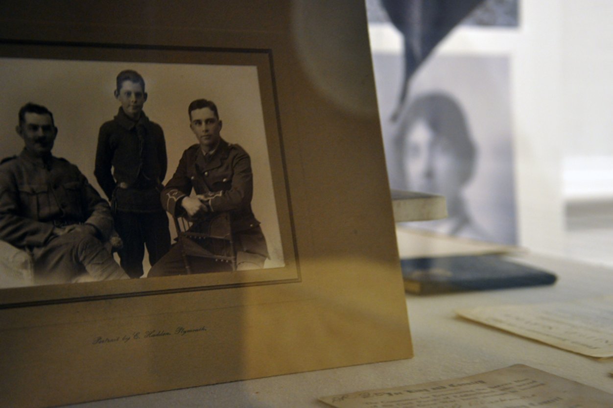 An old black and white photo of a family in uniform