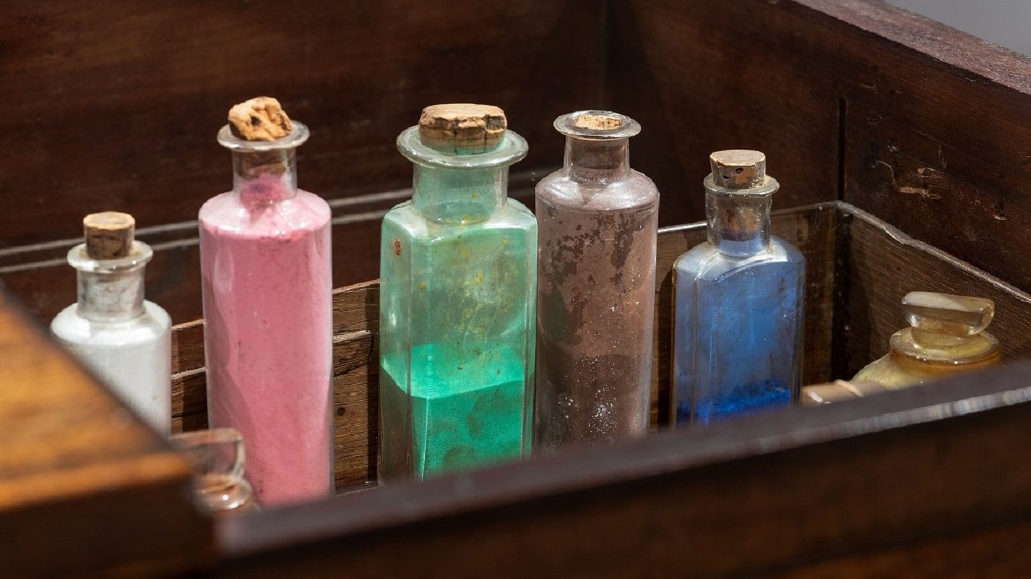 Brightly coloured bottles of pigment
