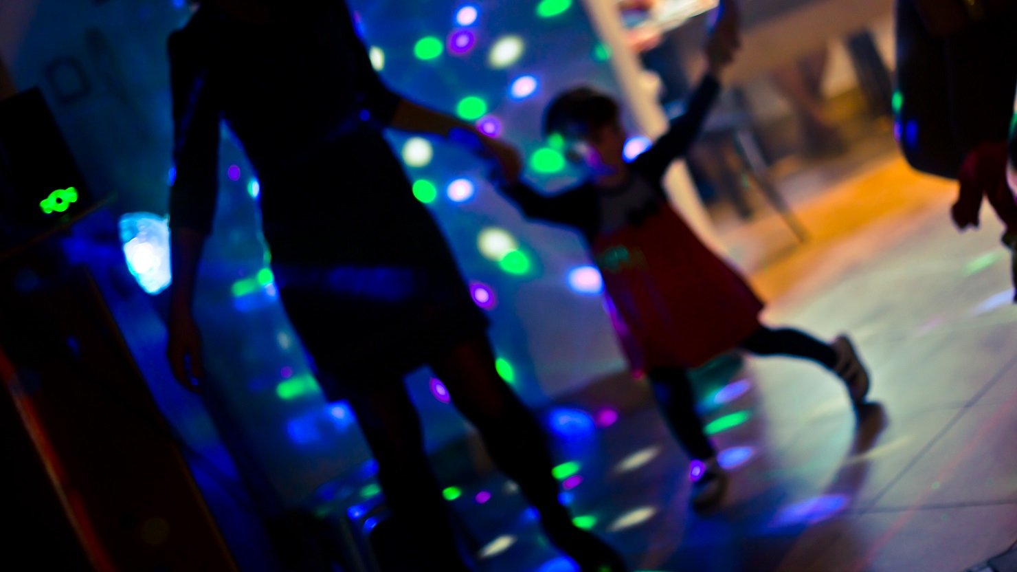 A family dancing at a disco