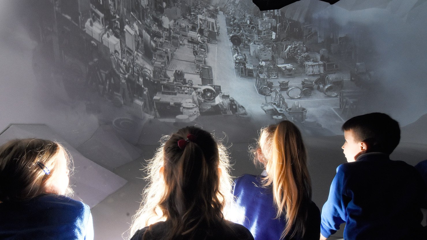 Children watching a projection at The Box, Plymouth