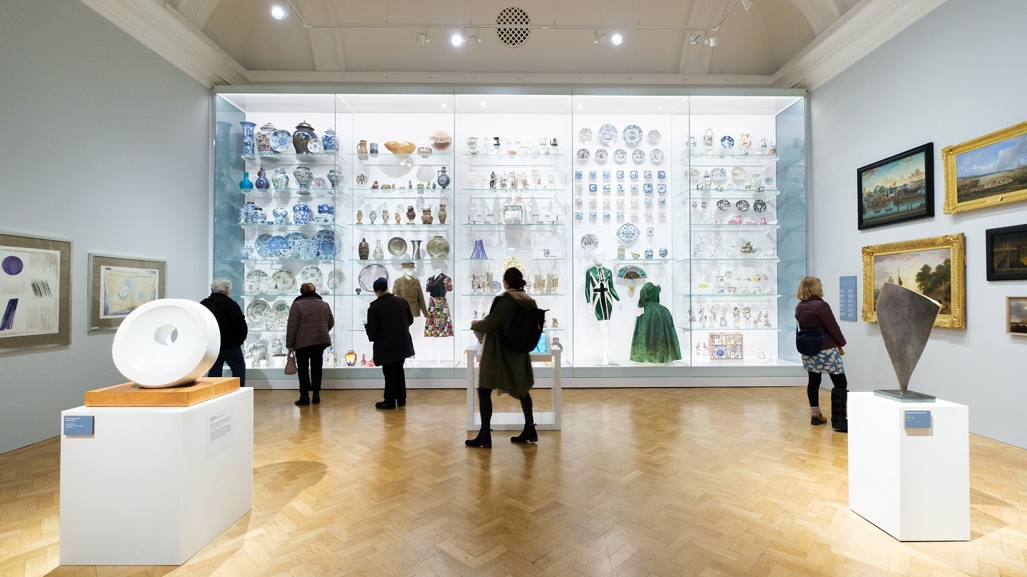A large case filled with ceramics and costume at The Box, Plymouth