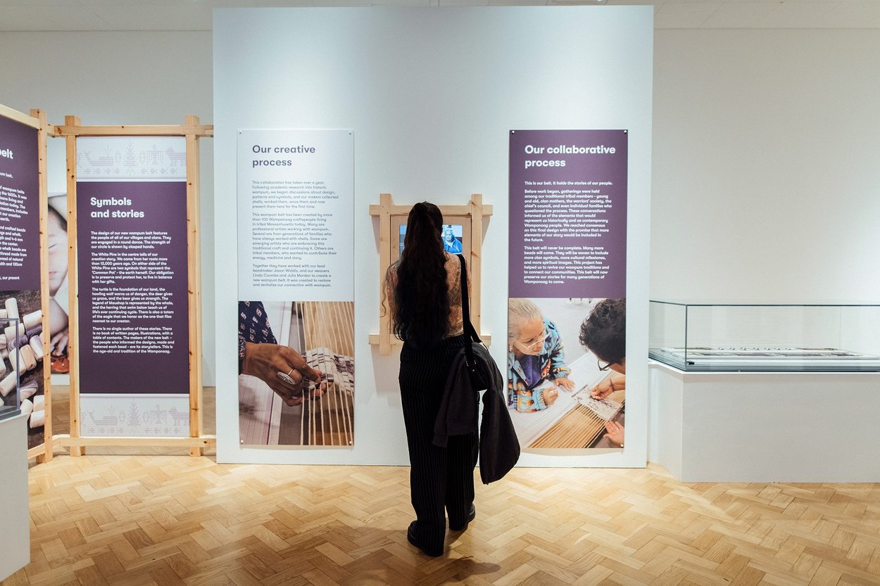 A visitor looking at the Wampum exhibition at The Box, Plymouth