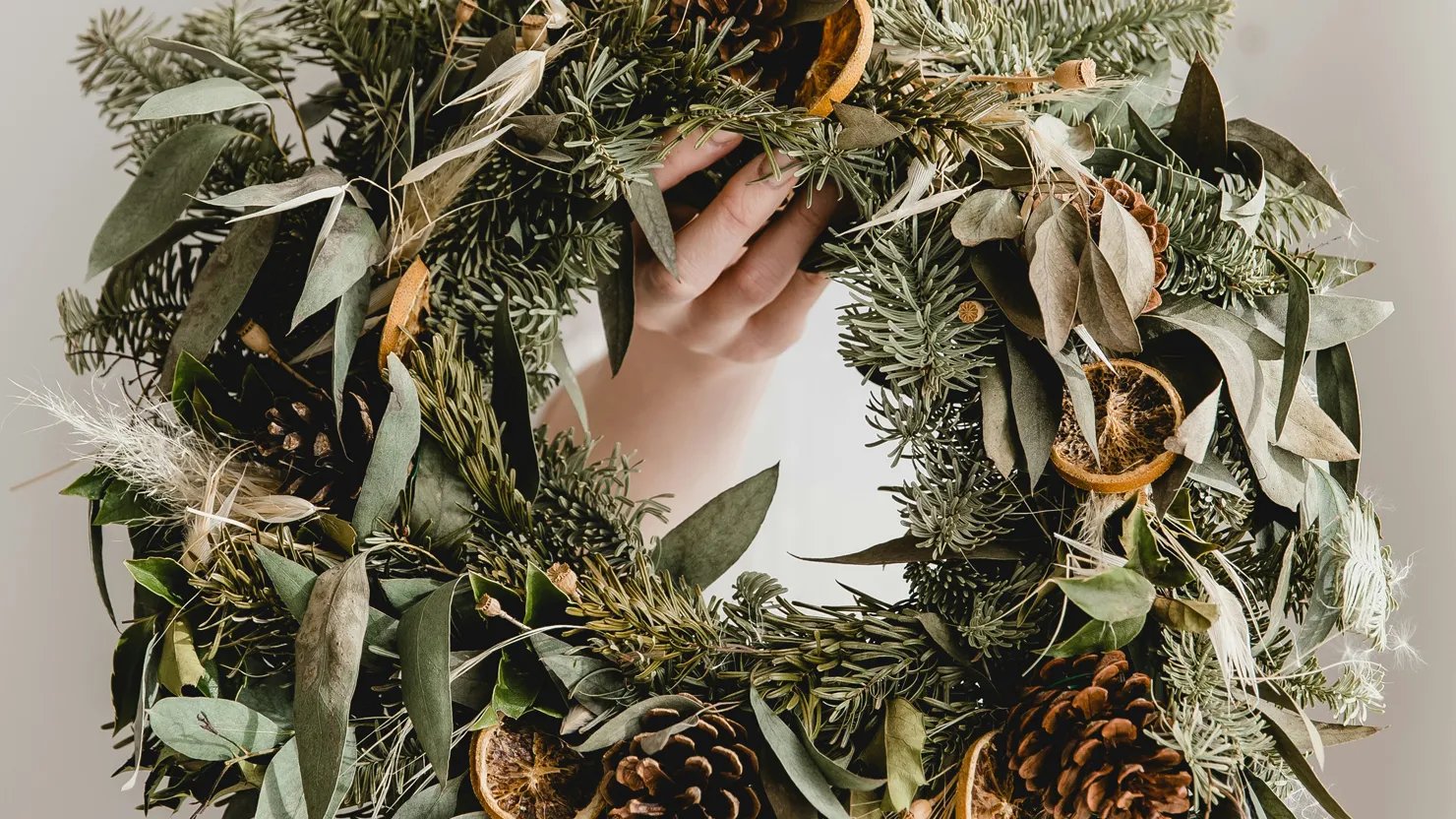 A festive wreath created from natural foliage and materials
