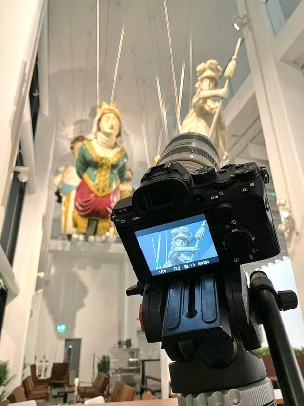 Camera capturing image of figureheads