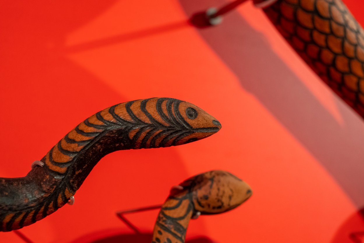 Closeup of wooden snake sculptures