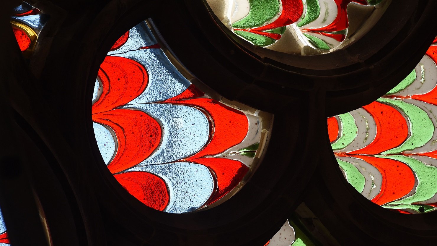 Detail of a colourful fused glass window