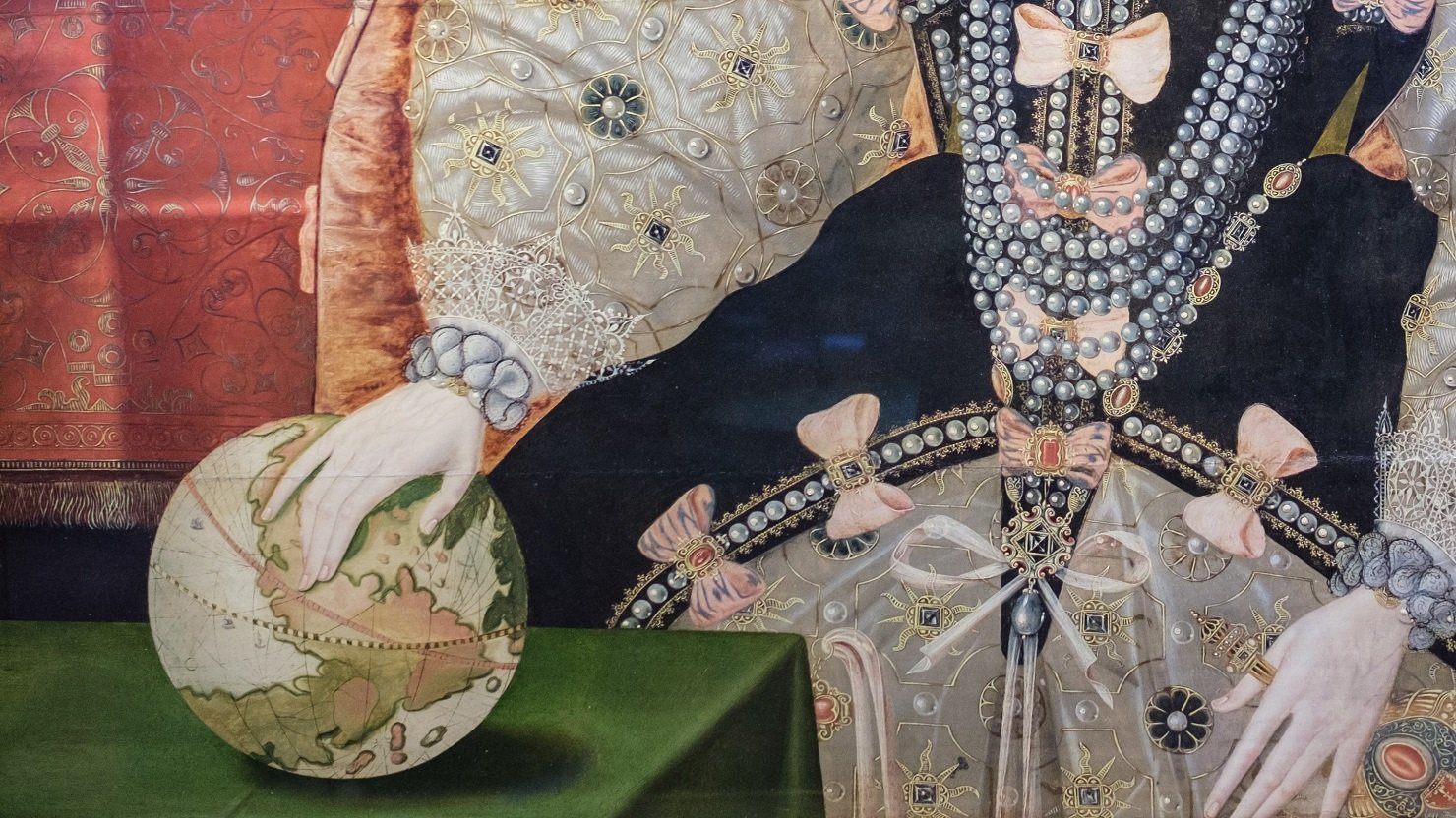 Close up of Queen Elizabeth I's hand on a globe from The Armada Portrait