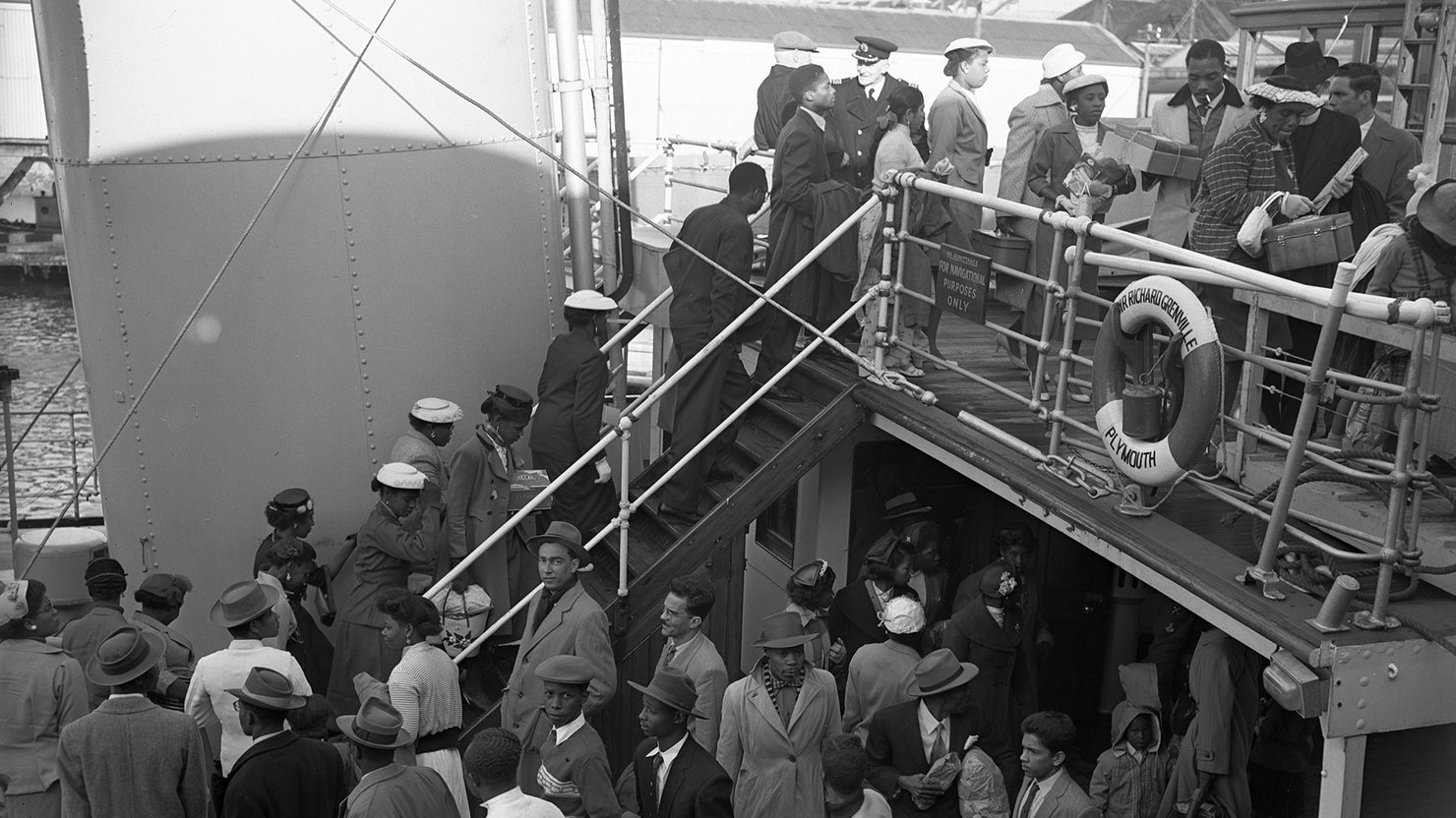 A large group of Jamaicans disembarking from the tender Sir Richard Grenville in Plymouth, circa January 1958 © Mirrorpix Banner