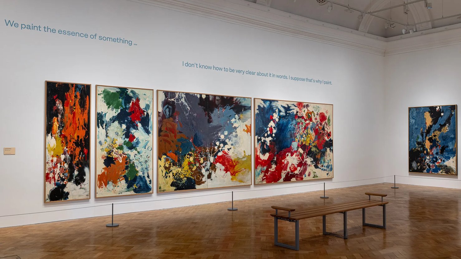 Photograph showing a gallery space with a series of large abstract works on the walls