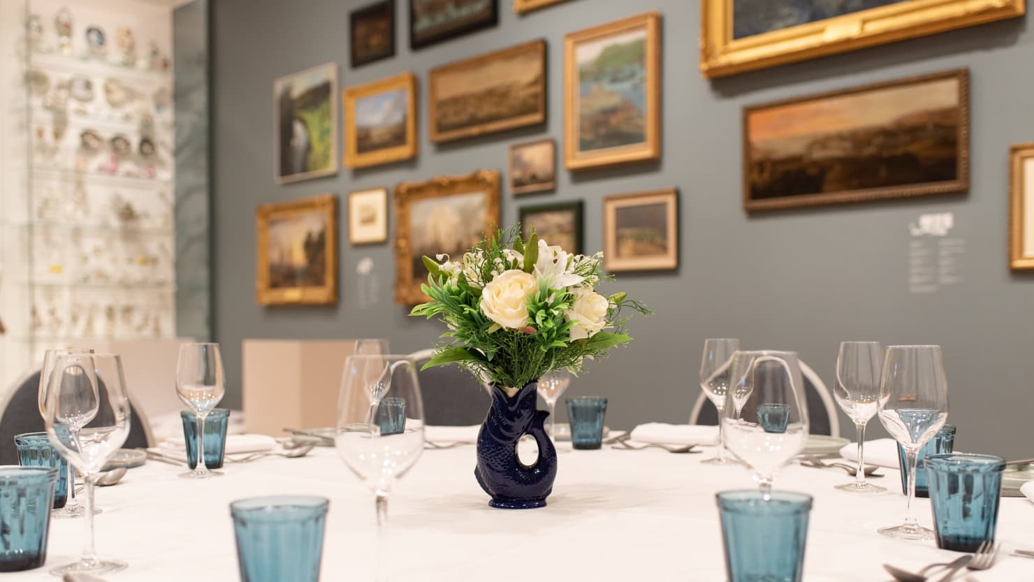 Photograph showing a table setup in a gallery space