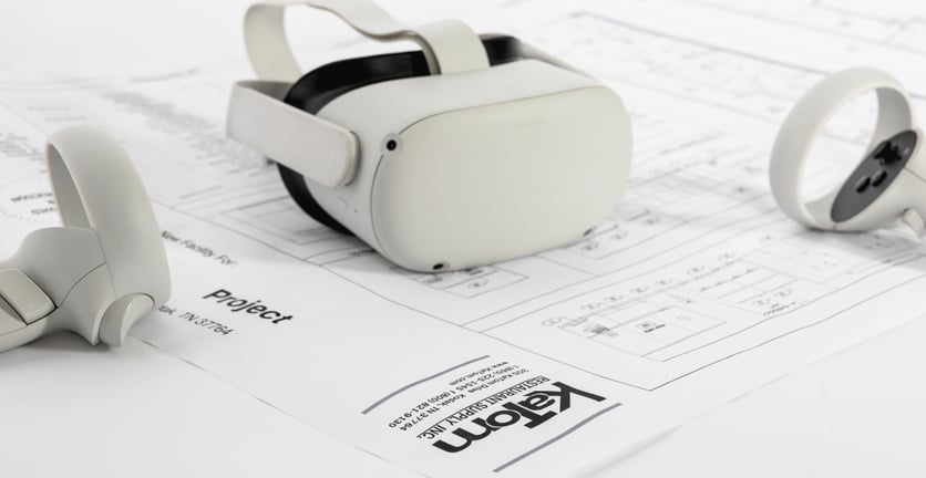 Image with an Oculus Rift on top of building plans