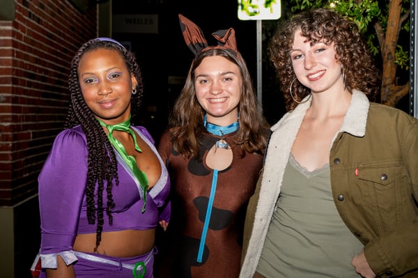 Close-up of detailed costumes on a lit street