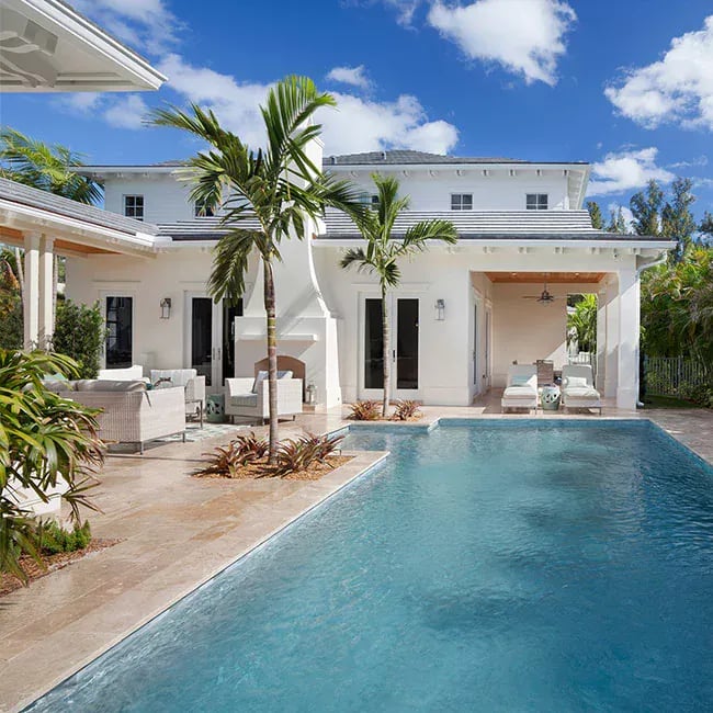 An image of a travertine pool in Melbourne with travertine tiles and pavers around it.