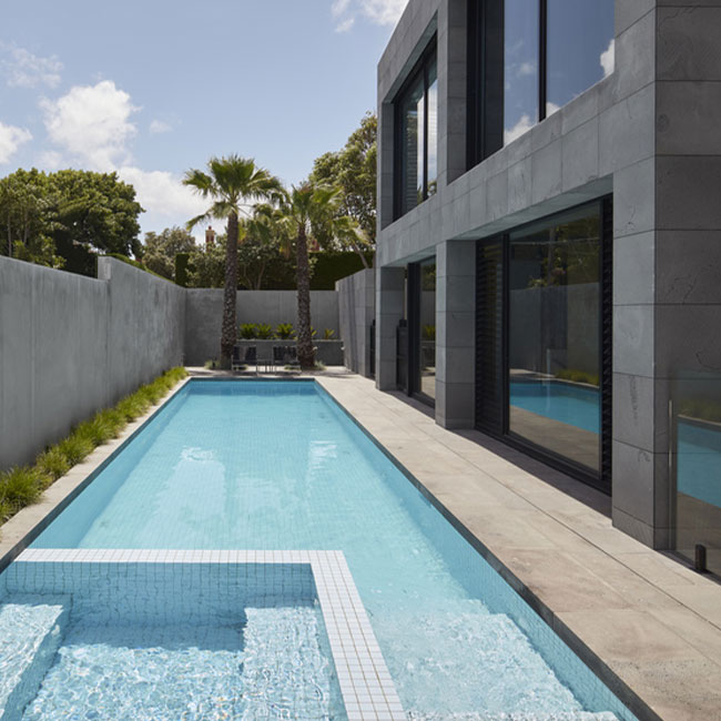 A picture of bluestone pavers around a pool in Melbourne.