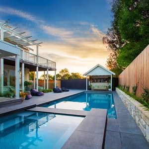 A picture of Black Granite pavers around a pool in Melbourne.