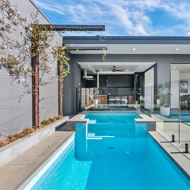 A picture of bluestone pavers around a pool in Melbourne.