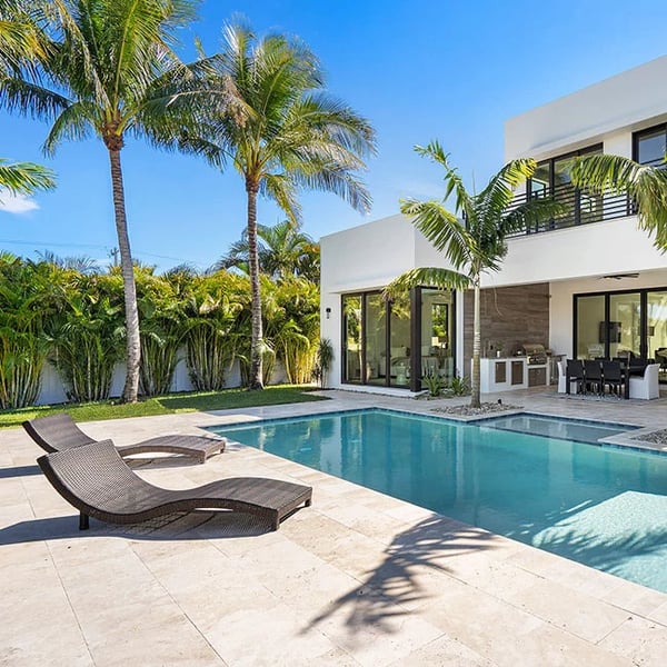 Image of travertine tiles in French Pattern around a pool in Melbourne