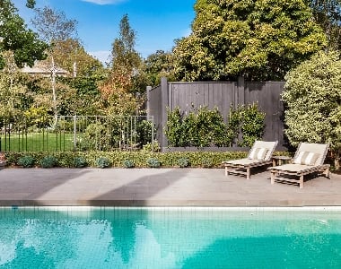 Image of bluestone pavers in Melbourne around a pool as tiles