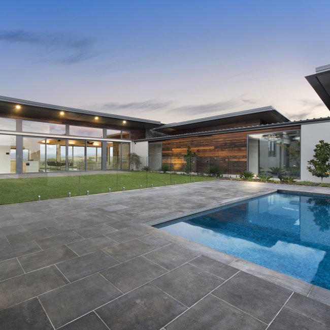 A picture of bluestone pavers around a pool in Melbourne.