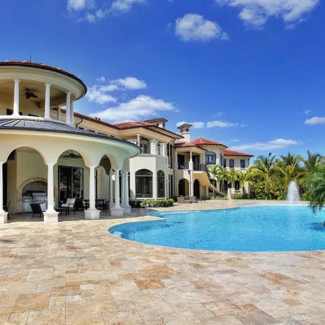 A picture of travertine pavers around a pool in Melbourne.