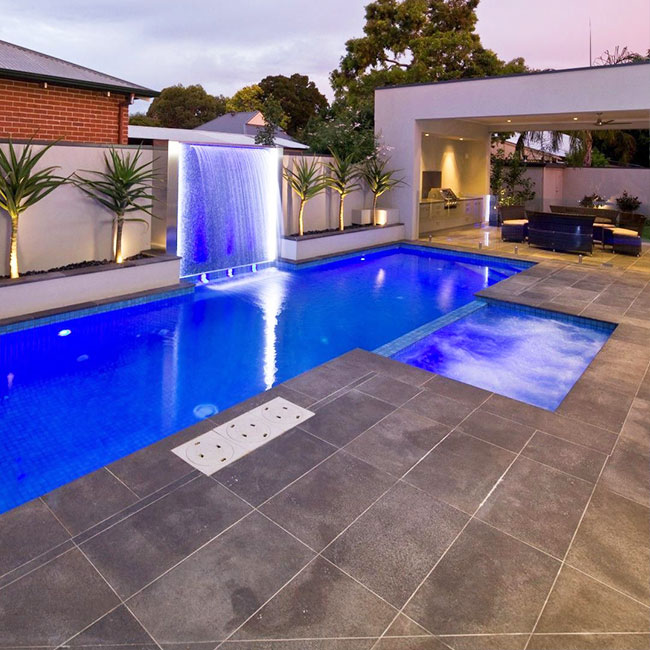 A picture of bluestone pavers around a pool in Melbourne.