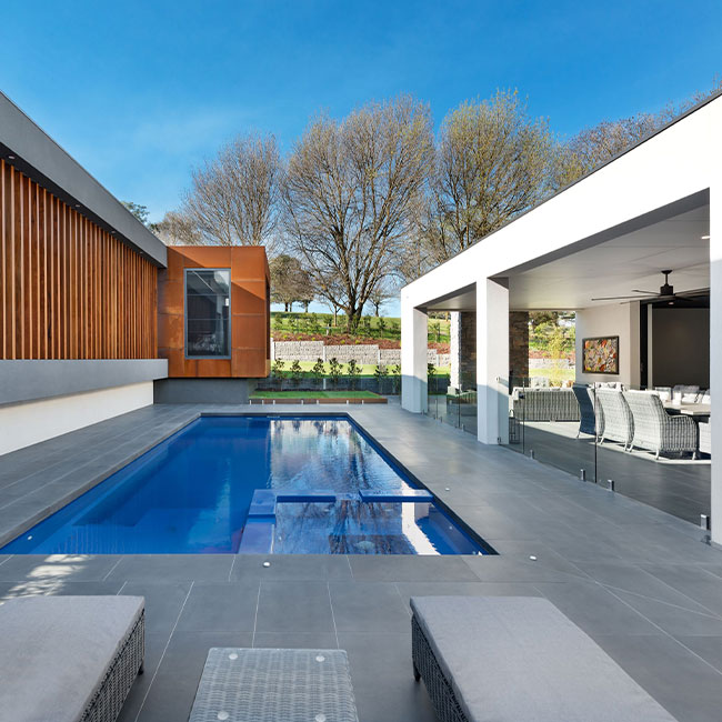 A picture of bluestone pavers around a pool in Melbourne.