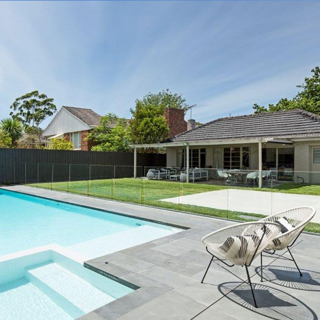 A picture of bluestone pavers around a pool in Melbourne.