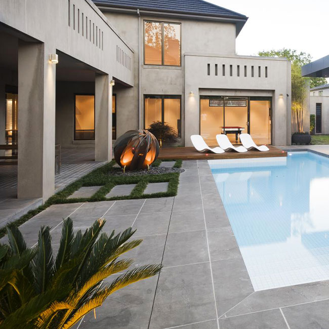 A picture of bluestone pavers around a pool in Melbourne.