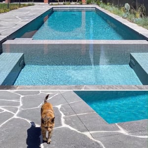 A picture of bluestone crazy paving around a pool in Melbourne.