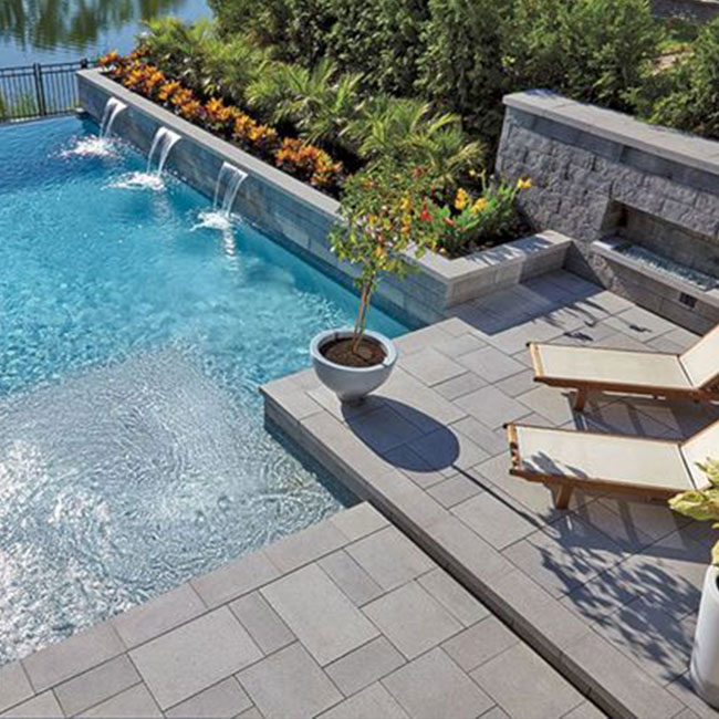 A picture of bluestone pavers around a pool in Melbourne.