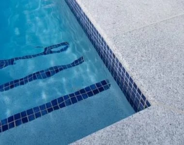 Dove granite bullnose pool coping poolside