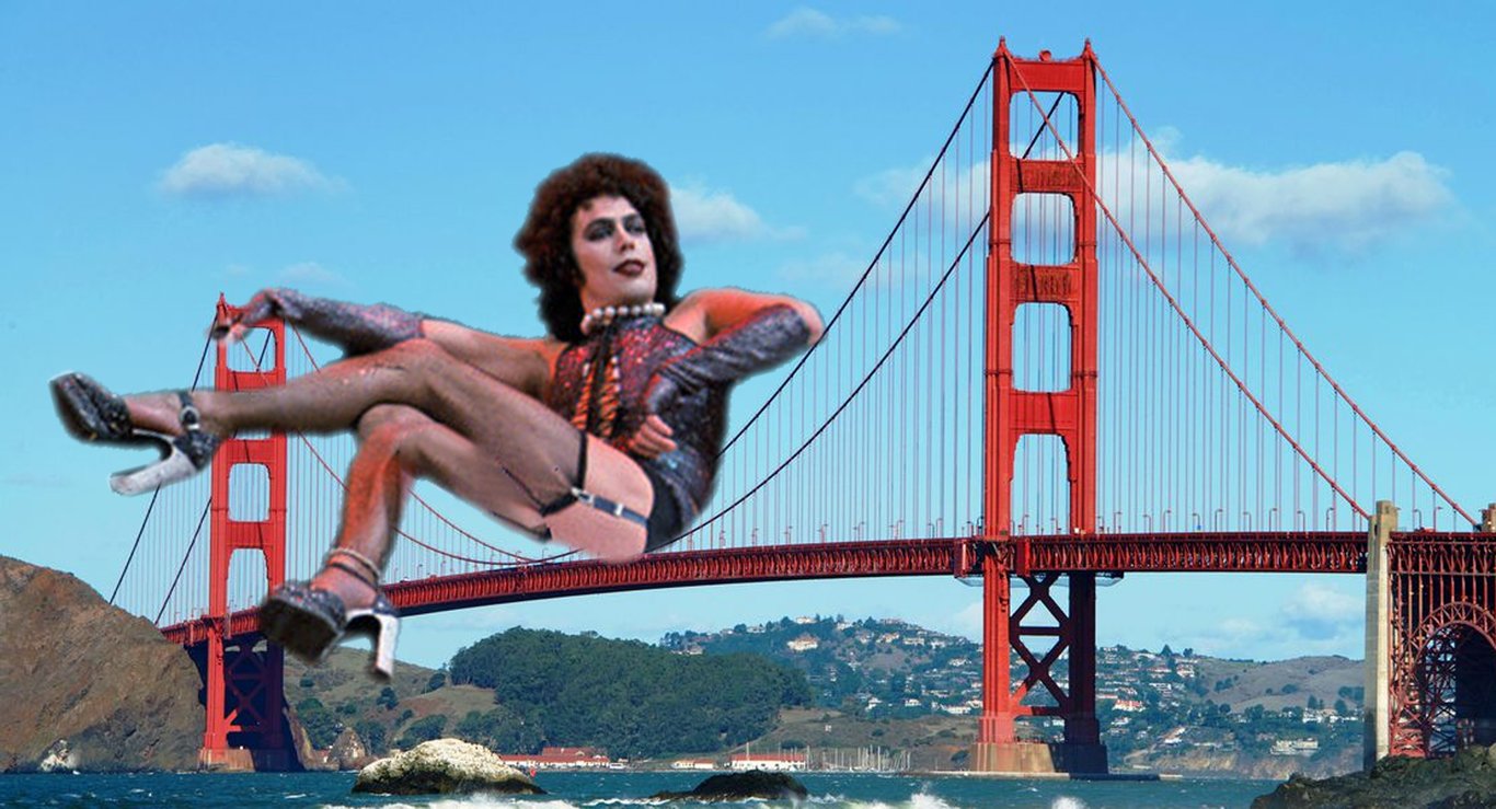 a giant doctor, frank n. furter, alighting atop the golden gate bridge