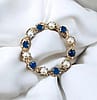 Vintage Wreath Pin with Sapphires and Cultured Pearls in 10 karat yellow gold circa 1970
