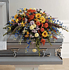 Colorful Memories Casket Spray by Grohe Florists