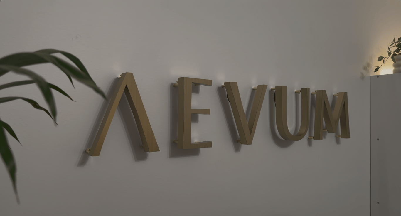 Raised AEVUM letters on the clinic wall