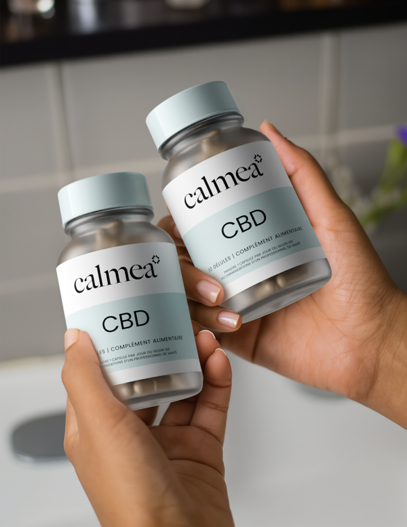 Calmea two bottles held in persons hands