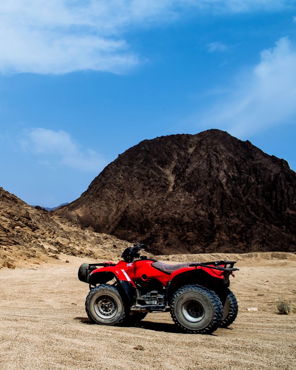 Red atv without people in the desert