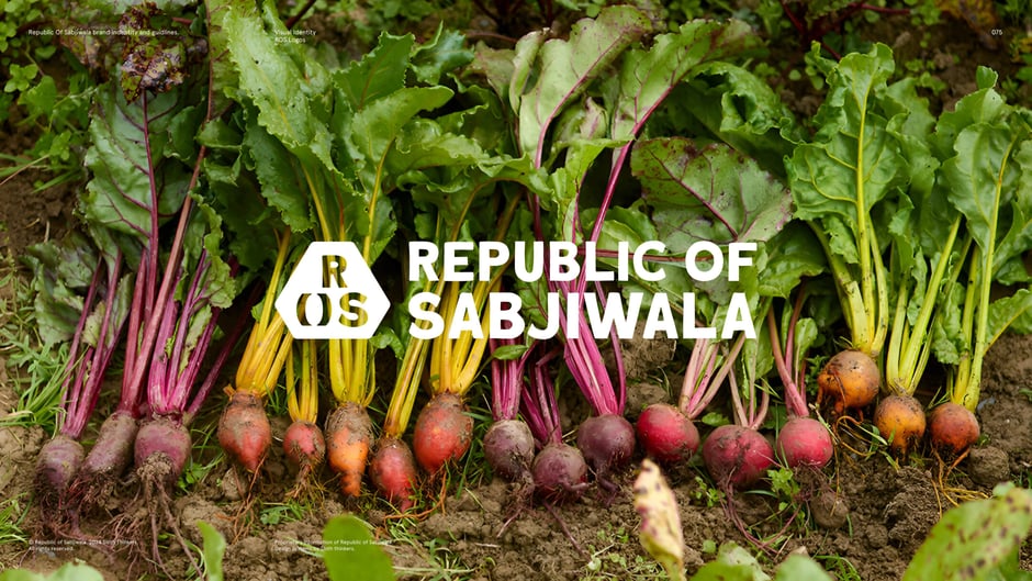 Wordmark plus emblem over harvest imagery