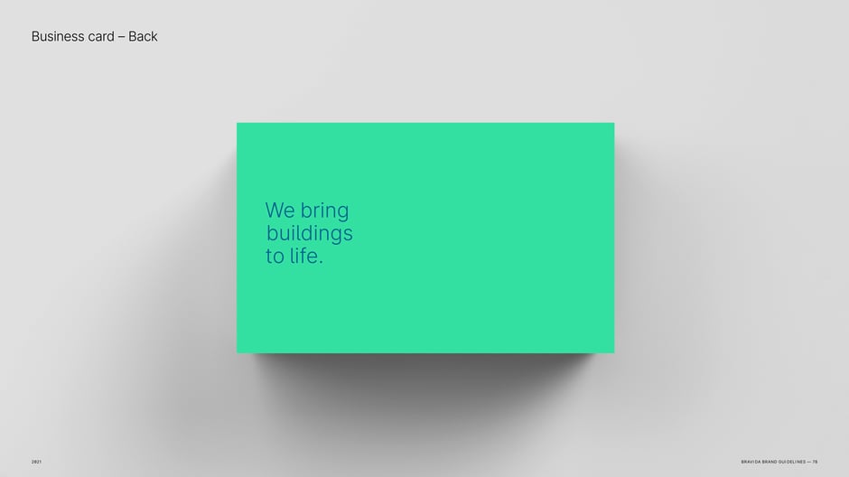 Business card back: full-bleed green with tagline