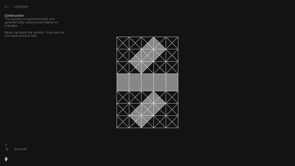 Shows the mathematical, triangle-based grid used to construct the symbol