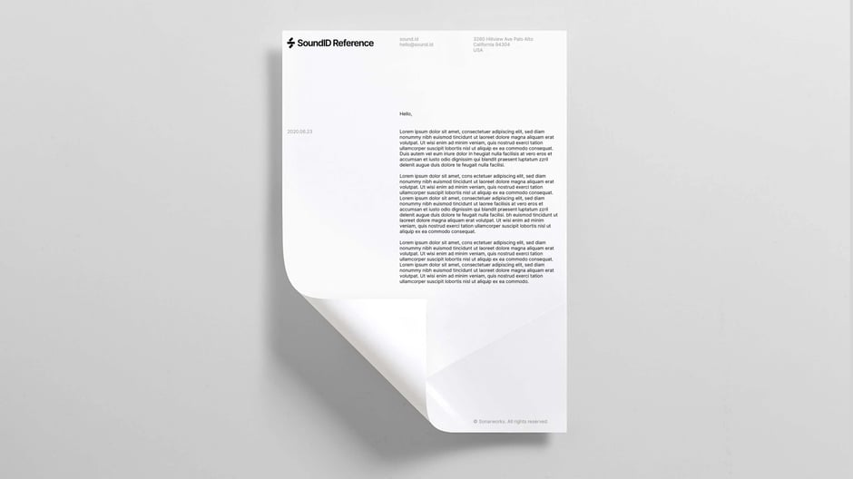 Official stationery mockup illustrating the brand's letterhead system, address block