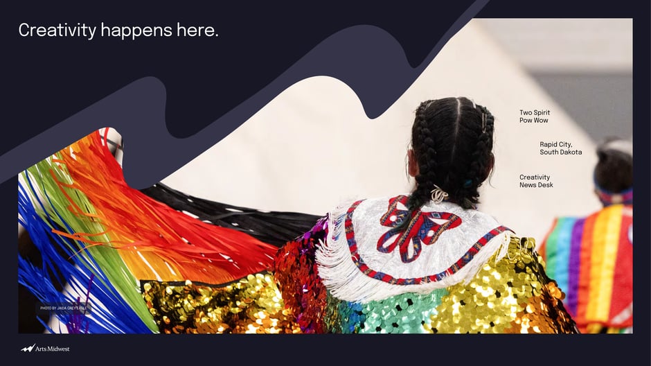 Uses a hero photograph (Two Spirit Pow Wow, Rapid City)