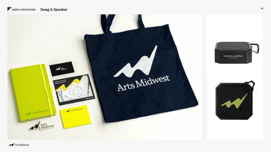 Branded swag: tote, notebook, stickers, portable speaker