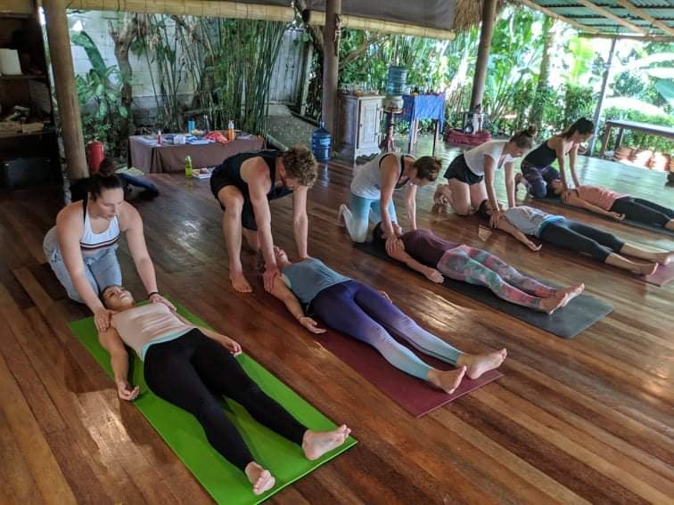 Yoga students in Savasana