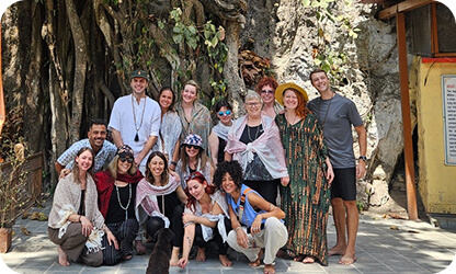 Loka Yoga School retreat group photo under a banyan tree in Bali