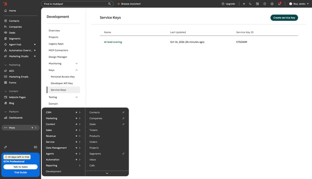 HubSpot More menu open on Development, with the Service Keys page and the Create service key button
